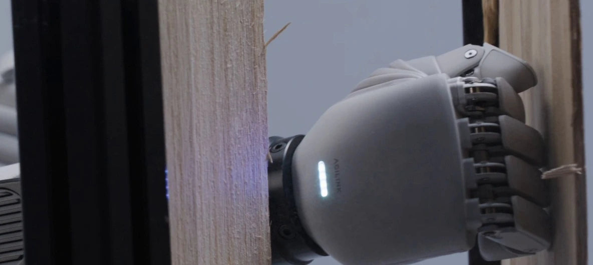 Original Lite-S hand making contact with a timber surface