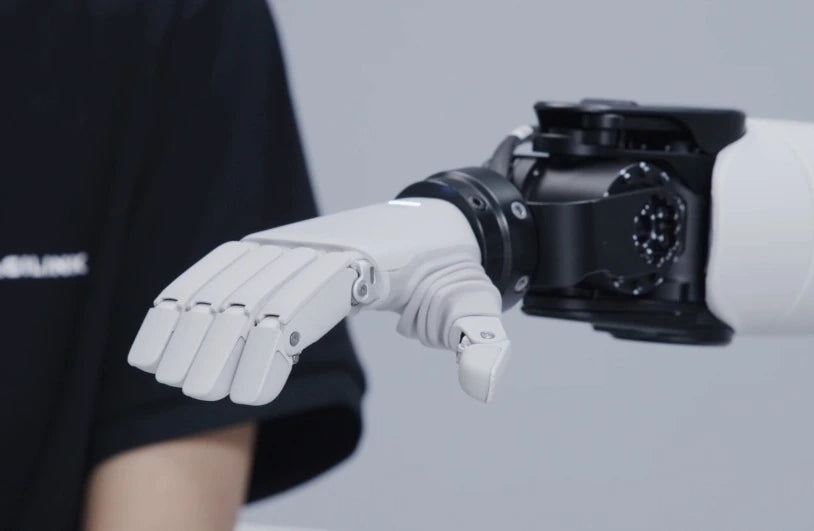 The original Lite-S hand connected to a compact humanoid wrist