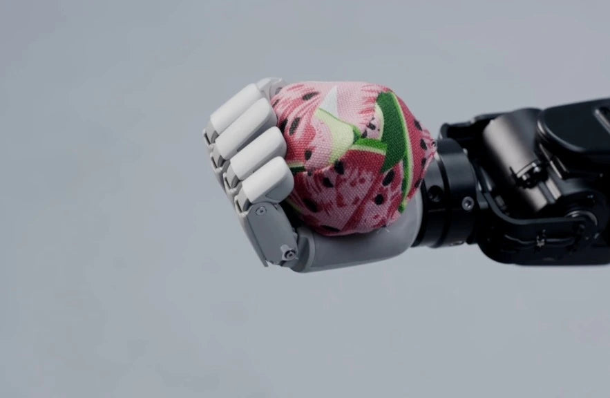 Original Lite-S fingers grasping a dragon fruit