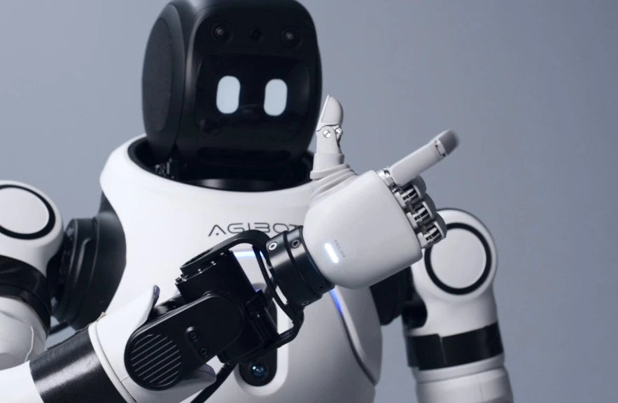 Compact humanoid wearing Lite-S and making a thumbs-up gesture